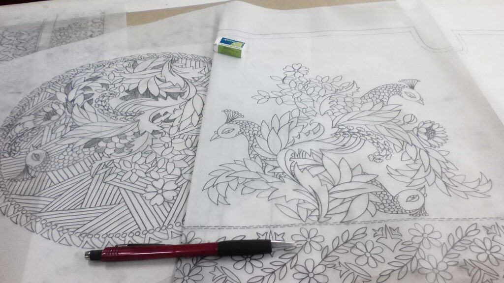 Intricate peacock and floral pencil sketches by Asgar Molla on tracing paper, showcasing fine detail and traditional Indian art motifs.