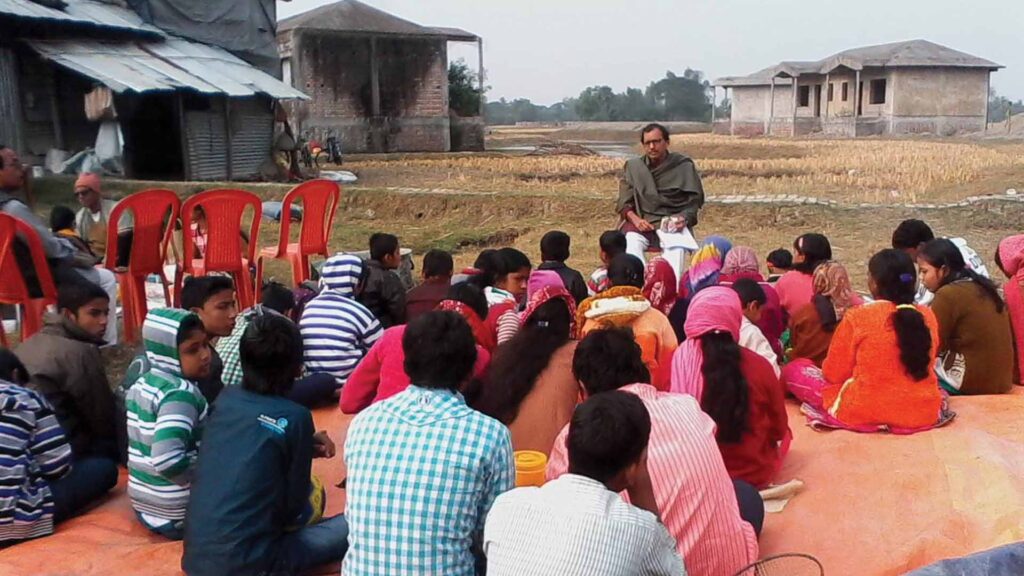 Sukumar Paira Sir teaching students in an outdoor classroom at an old tourist spot near Bijoynagar Adarsha Vidyamandir (H.S).