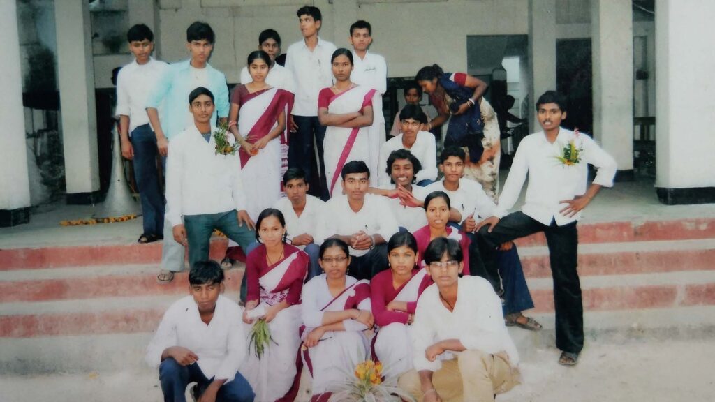 Group photo of students from Bijoynagar Adarsha Vidyamandir (H.S) in school uniform on steps of school building