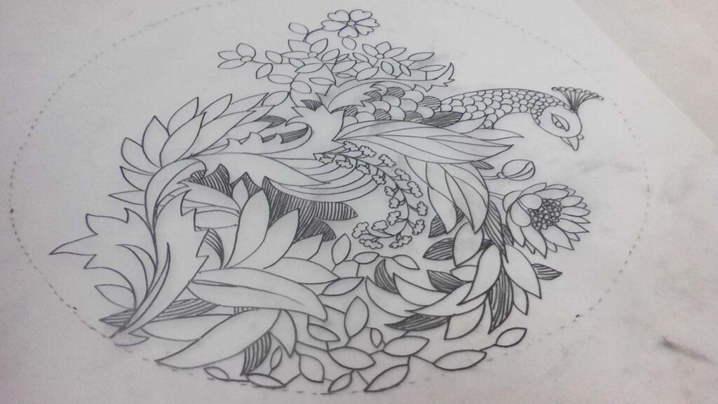 Peacock and floral motif hand-drawn on khaka tracing paper for traditional boutique embroidery.
