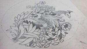 Peacock and floral motif hand-drawn on khaka tracing paper for traditional boutique embroidery.