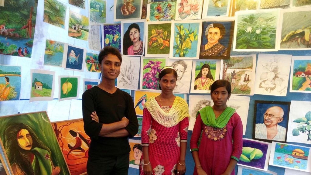 Children creating and showcasing artwork at a rural art education event, with Asgar Molla also present.