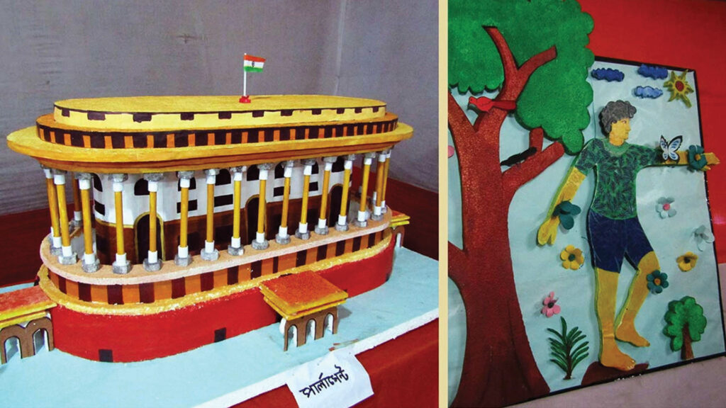 Handmade Parliament House model and colorful nature-themed wall art displayed at school exhibition.