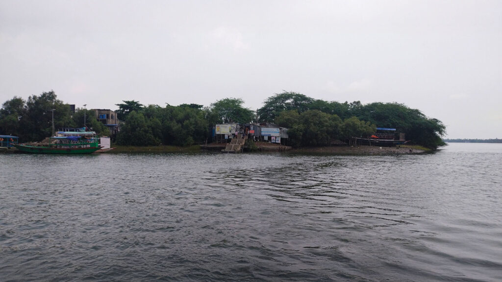 Riverfront view of Gadkhali Ferry Ghat surrounded by greenery